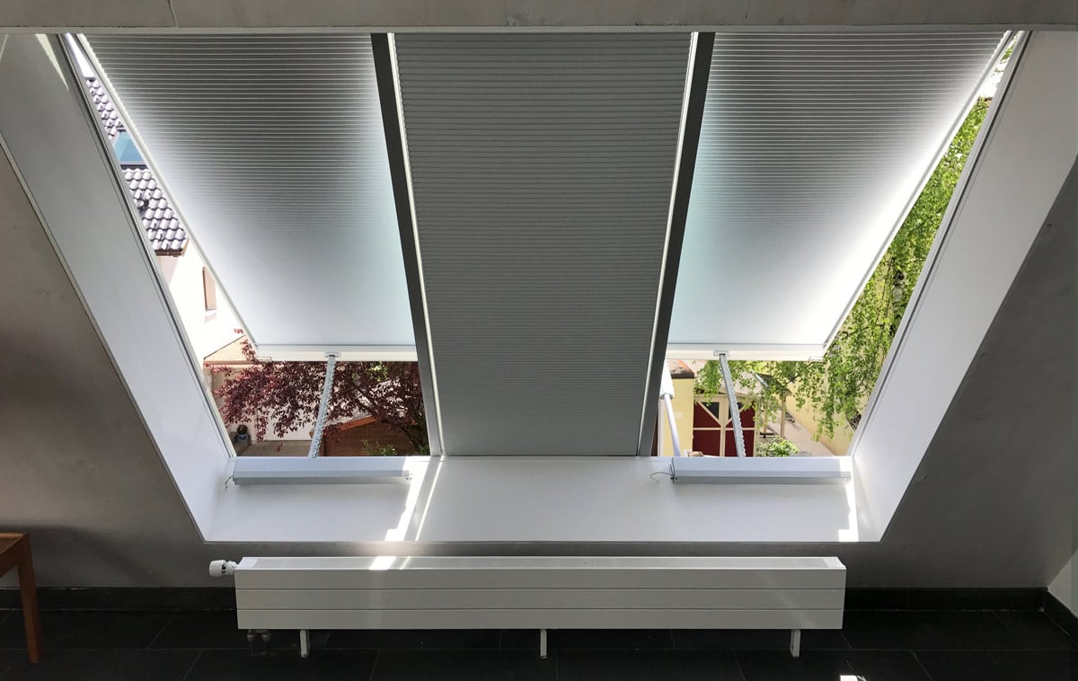 Automatically controlled pleated interior blinds of a panoramic window. Step 3